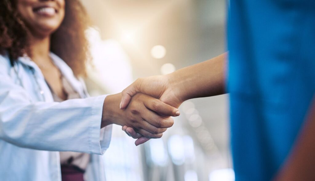 two doctors shaking hands