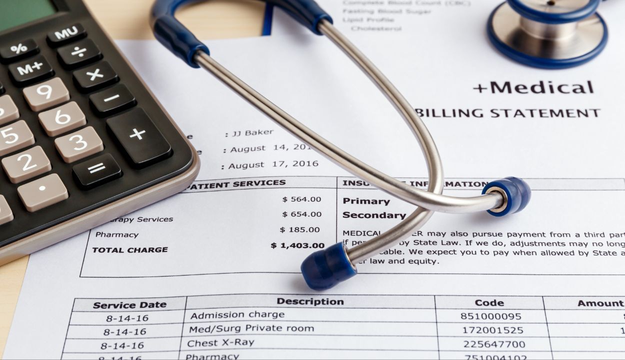 medical billing invoices displayed with calculator